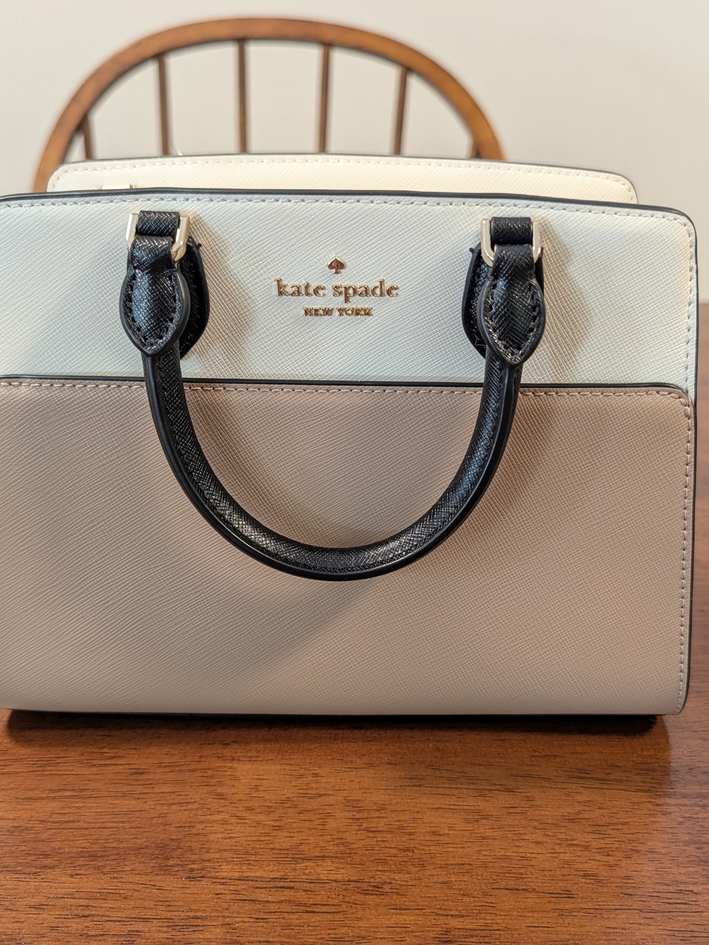kate spade two-tone cream and beige satchel with black handles